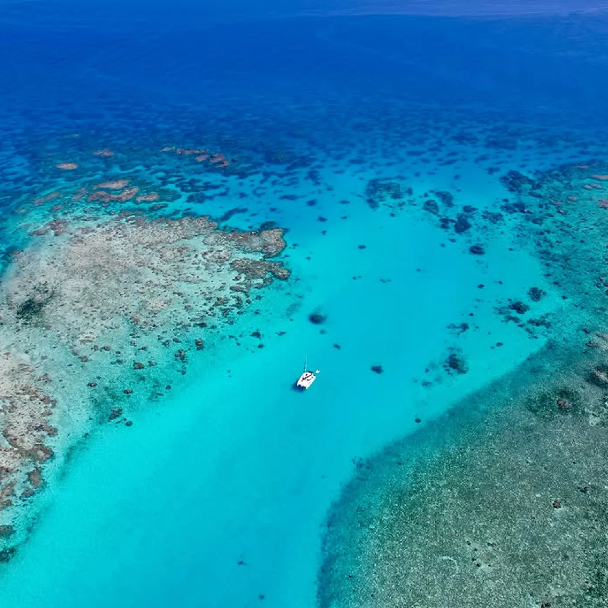 great barrier reef with boat on water