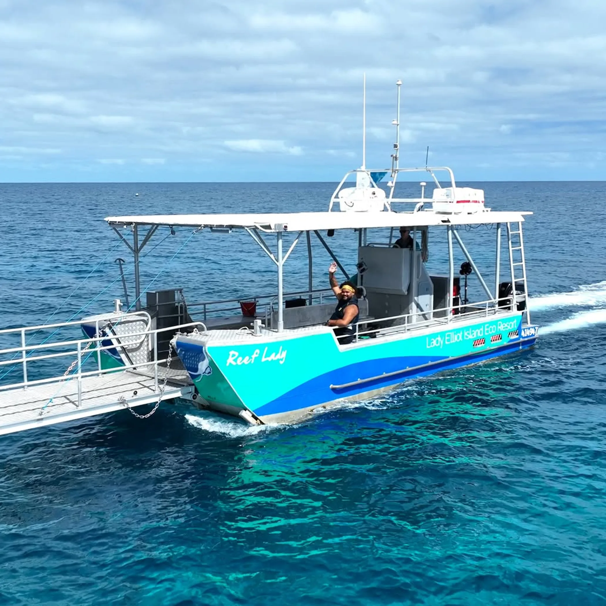 reef tour boat on clear water